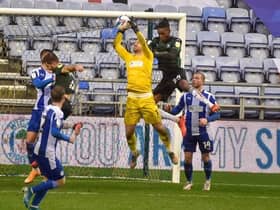 Jamie Jones makes another save for Latics