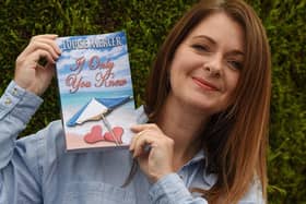 Louise Mercer with her novel