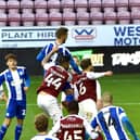 Tom James heads home Latics' second goal
