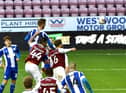 Tom James heads home Latics' second goal