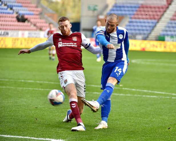 Joe Garner shoots for goal against Northampton
