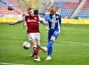 Joe Garner shoots for goal against Northampton