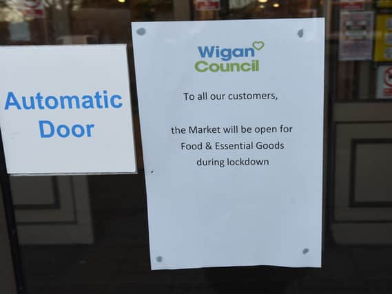 A sign on display at Wigan Market