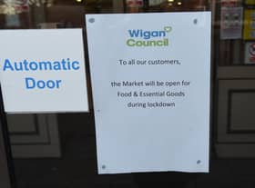 A sign on display at Wigan Market