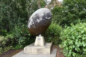 The statue is near the entrance to the Tesco Extra car park