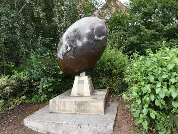 The statue is near the entrance to the Tesco Extra car park