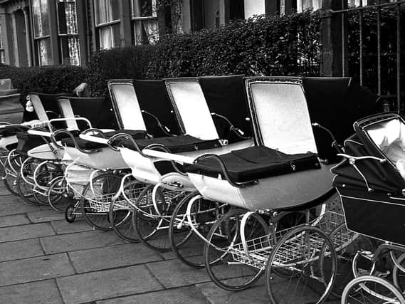 A line of prams parked outside St Andrew's Family Clinic, Wigan, in 1967