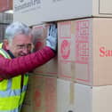 Some of the boxes being packed onto the lorry