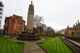 Social distancing signs have been placed on the floor at Wigan's war memorial