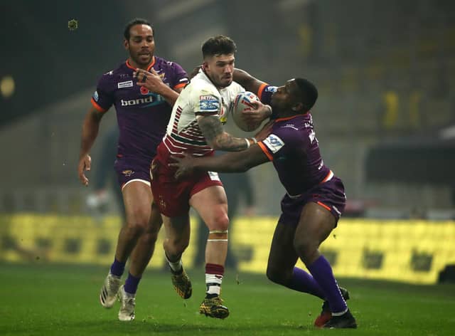 Oliver Gildart looks to break through the Huddersfield line