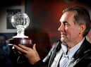 George Best with his Hall of Fame trophy during his visit to the National Football Museum at Deepdale in 2003