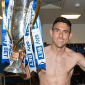 Gary Roberts celebrates winning the League One title in 2018