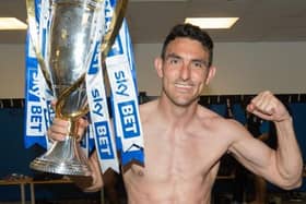Gary Roberts celebrates winning the League One title in 2018