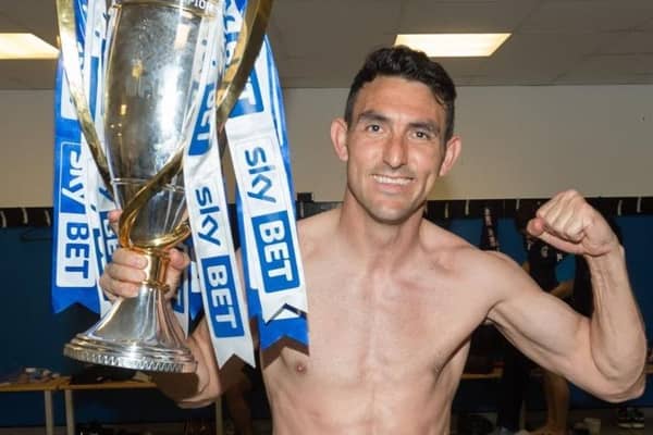 Gary Roberts celebrates winning the League One title in 2018