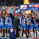 Gary Caldwell celebrates with his 2015-16 League One title winners
