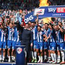 Gary Caldwell celebrates with his 2015-16 League One title winners