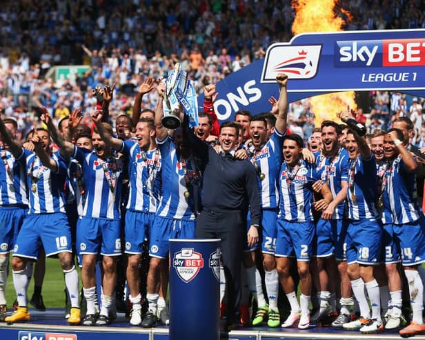 Gary Caldwell celebrates with his 2015-16 League One title winners