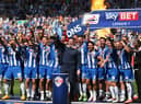 Gary Caldwell celebrates with his 2015-16 League One title winners