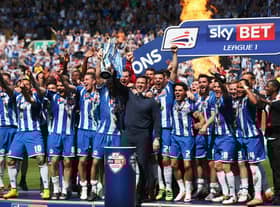 Gary Caldwell celebrates with his 2015-16 League One title winners