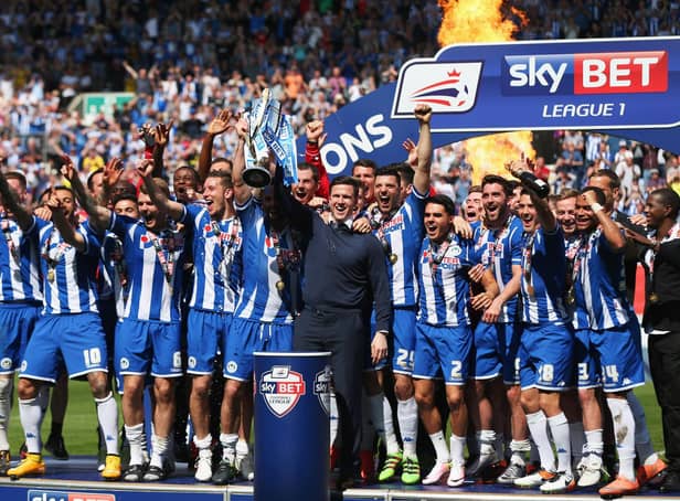 Gary Caldwell celebrates with his 2015-16 League One title winners