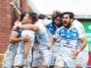 Toulouse celebrate a try in a match against York... both clubs could be in the mix for a Super League spot
