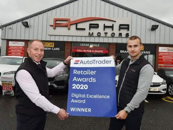 Managing director Graham Hogg, left, and marketing manager Dom Impalis at Alpha Motors, Wigan, celebrate winning the Auto Trader retail award for digital excellence.