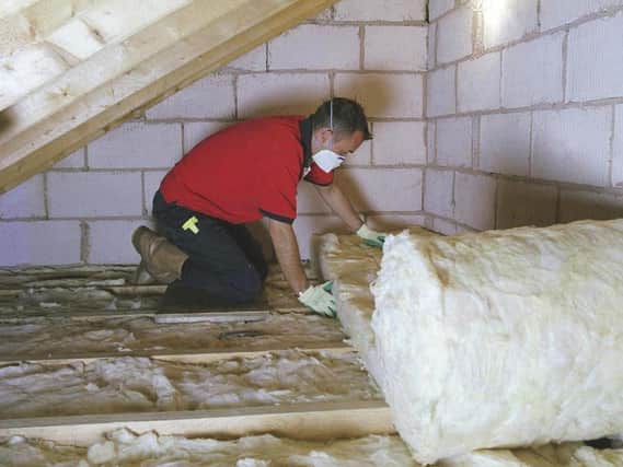 Loft insulation being installed