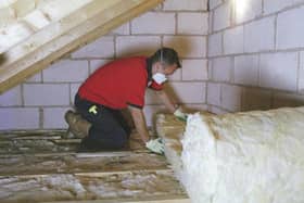 Loft insulation being installed