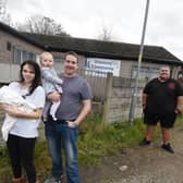 Courtney Bampton with children Tommy and Lilly-Mae, Coun Jones and Ben Charlton of Bryn Support Centre