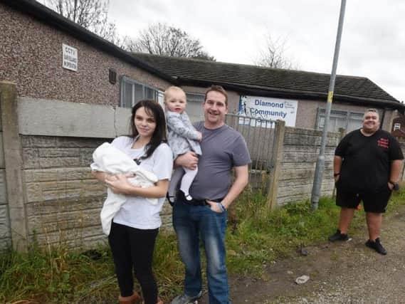 Courtney Bampton with children Tommy and Lilly-Mae, Coun Jones and Ben Charlton of Bryn Support Centre