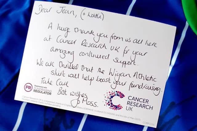 Cancer Research donated a signed Wigan Athletic shirt to help Jean's fund-raising