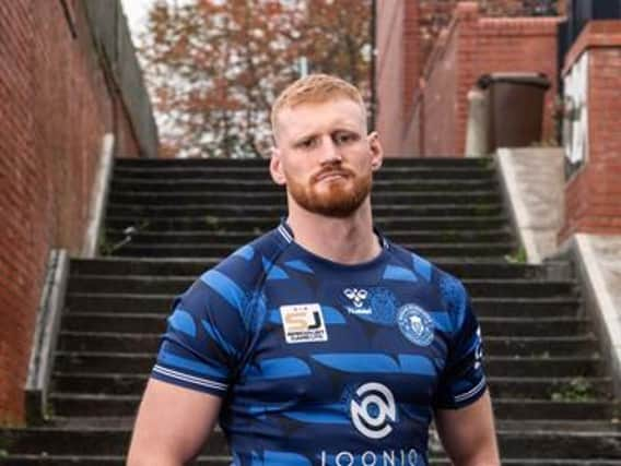 Joe Bullock models the 2021 away shirt