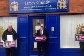 James Grundy, pictured with resident campaigners, has launched a petition against the proposed route