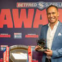 Adrian Lam with the Coach of the Year prize and the League Leaders' Shield