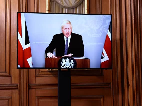 Prime Minister Boris Johnson, who is self-isolating, appears via video link during a media briefing in Downing Street.