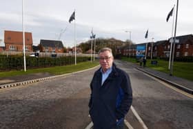 Coun Ray Whittingham stands near to the grass verge on Rectory Lane, Standish