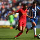 Jordan Flores in action for Latics against Liverpool