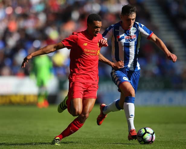 Jordan Flores in action for Latics against Liverpool