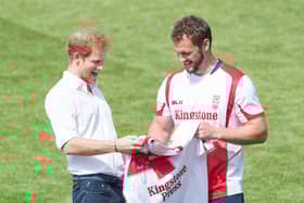 Sean O'Loughlin presents Prince Harry with an England shirt