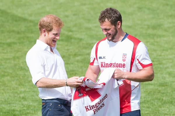 Sean O'Loughlin presents Prince Harry with an England shirt