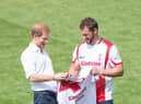 Sean O'Loughlin presents Prince Harry with an England shirt