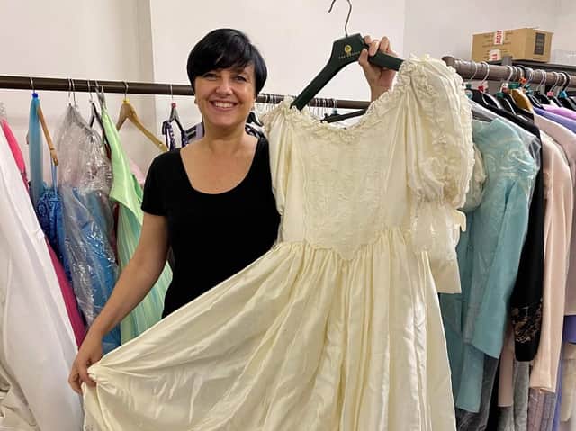 Wigan and Leigh Hospice retail co-ordinator Jenny McAvoy with the dress
