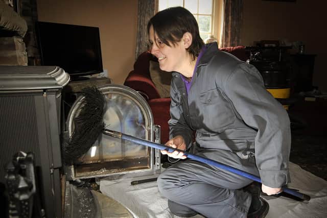 A chimney sweep at work