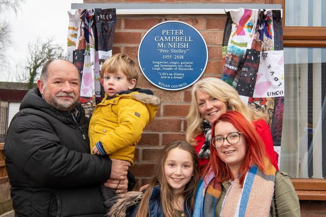 Pete Shelley's family with the memorial to the punk musician