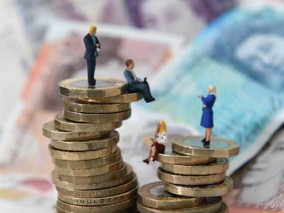 Women working in Wigan earned an average hourly salary of £11.94 as of April – seven per cent less than men, who earned £12.77