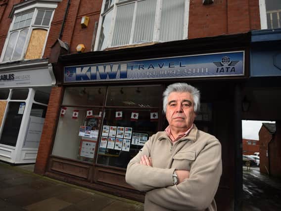 Norman Taylor outside his now-closed business Kiwi Travel