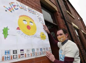 Marcus Walsh shows off a poster