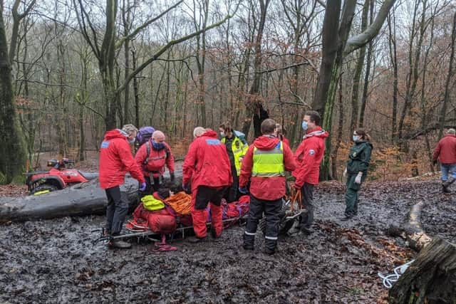 Bolton Mountain Rescue Team members and North West Ambulance Service staff went into the woods to help the man
