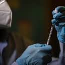 Experts say it would take almost a year to vaccinate the entire UK population against Covid-19.