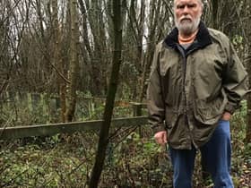 Coun Vickers with some of the fly-tipped rubbish